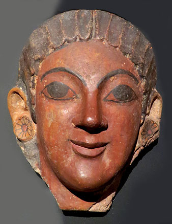 Acroteri de terra cuita en forma de cap femení d'un edifici etrusc. Segle VI aC
